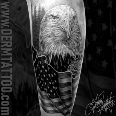 Black and gray tattoo of a bald eagle with an American flag.