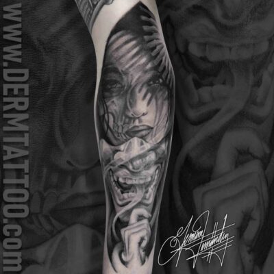 Black and grey tattoo of a fierce bird on a forearm.