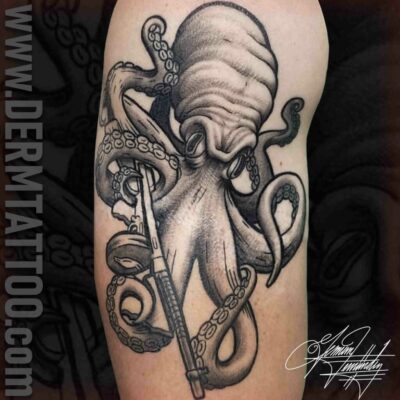 Black and gray octopus tattoo with detailed shading on forearm.