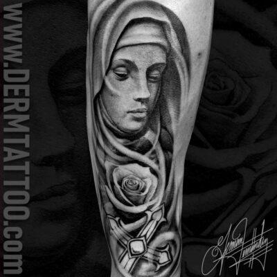 Black and grey tattoo of a woman's face with a rose beneath it.