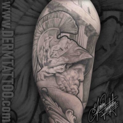 A detailed black and gray tattoo of a Roman soldier in armor.