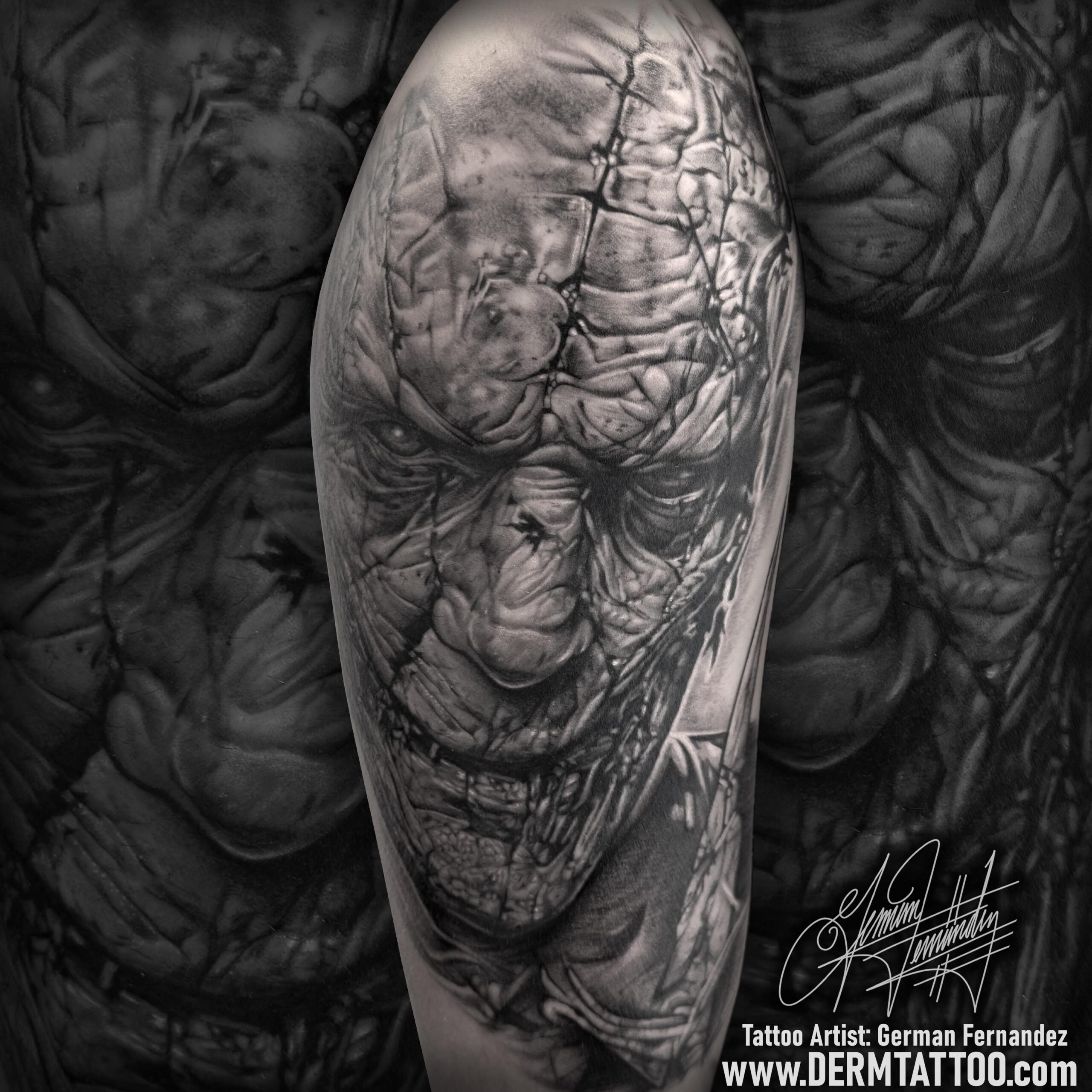 A detailed tattoo of a serene face with closed eyes on an arm.